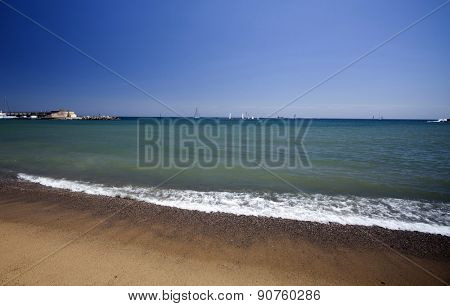 BARCELONA, SPAIN - MAY 5: Barceloneta Beach in May5, 2013 in Barcelona, Spain.  Barceloneta is a neighborhood in the Ciutat Vella district of Barcelona in front of the mediterranean sea.