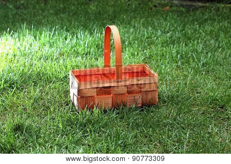 Straw basket in green grass
