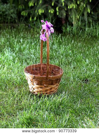 Straw basket in green grass