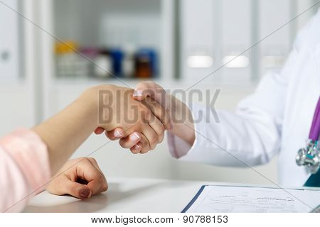 Doctor And Patient Shaking Hands
