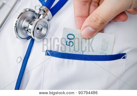 Patient Bribing Doctor, Puts Money Into The Pockets