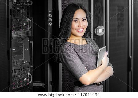 Engineer businesswoman in network server room