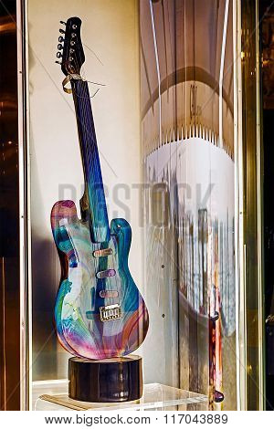 Glass Guitar Displayed In A Shop Window