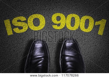 Top View of Business Shoes on the floor with the text: ISO 9001