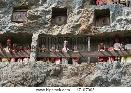 Wooden Statues Of Tau Tau. Lemo Is Cliffs Old Burial Site In Tana Toraja. South Sulawesi, Indonesia