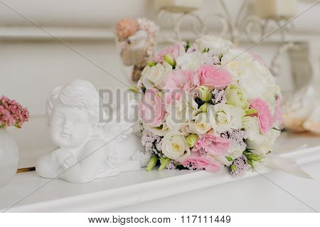 Wedding flower with Angel near flower.
