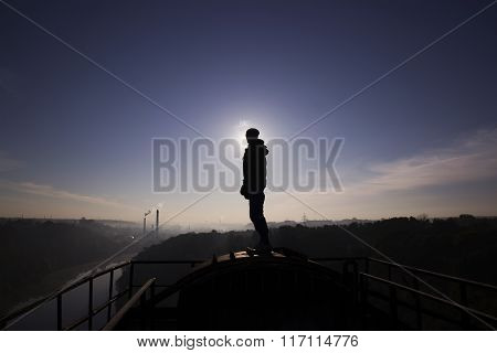 Man On Top Of The Bridge