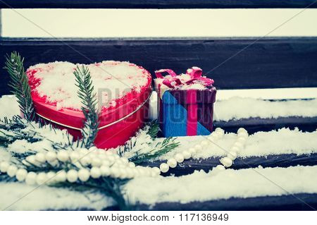 A Gift Box, White Pearl Necklace, Red Heart Shaped Tin Box With A Fragment Of A Pine-tree Branch