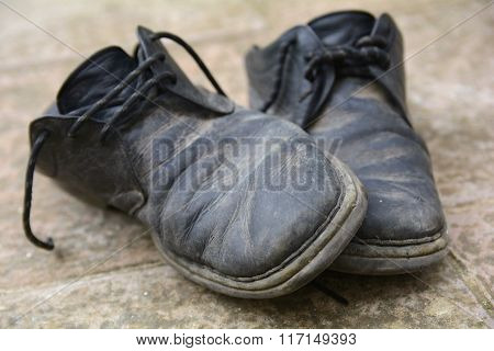 Dirty and damaged old shoes