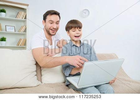 Father having hilarious time with son