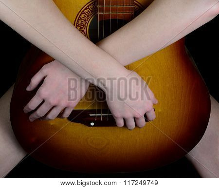 Girl Hugging An Acoustic Guitar