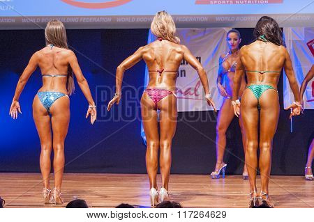 Female Figure Model Shows Her Best At Championship On Stage