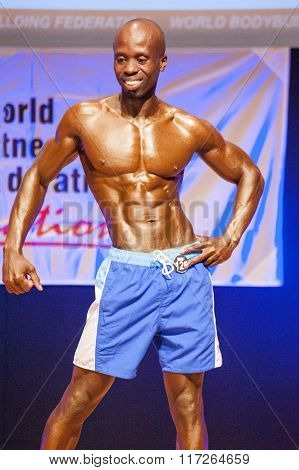 Male Fitness Model Shows His Physique In Swimsuit Om Stage