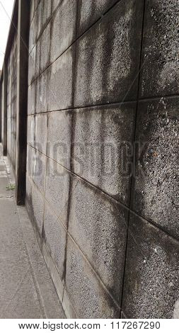 Wall Of An Old House Made Of Brick Blocks.
