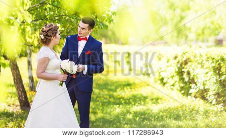 Just married couple embraced.