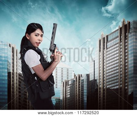Beautiful Police Woman Holding Gun