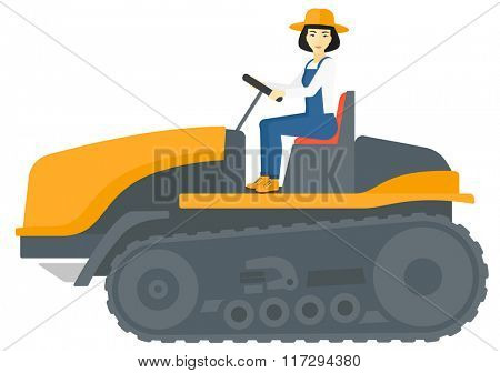 Farmer driving catepillar tractor.