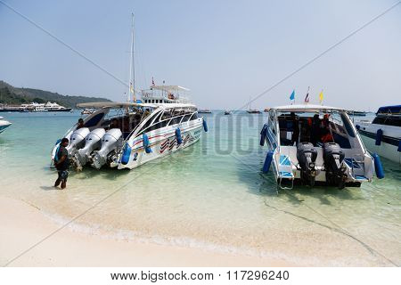 PHI PHI ISLANDS, THAILAND - CIRCA FEBRUARY, 2015: Speed boats on the shore of the island of Phi Phi Doh in the Andaman Sea. Island is very popular with tourists from all over the world
