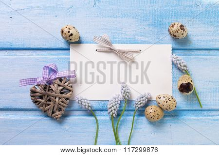 Decorative Heart, Eggs, Spring Flowers On  Blue Wooden Background.