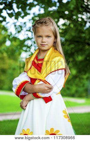 Close up Little girl is dressed in the Russian national dress Ã??Ã?? summer park