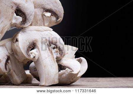 macro feild mushroom on the wooden textured table