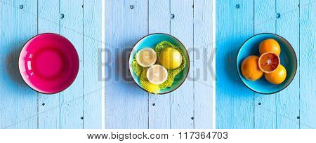 Colorful Orange fruits over a light blue painted wood table with a simmetric position.