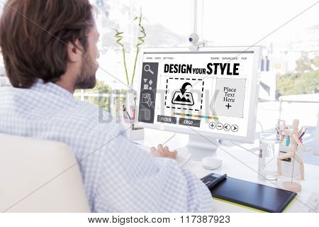 Desinger working on his computer against designer interface