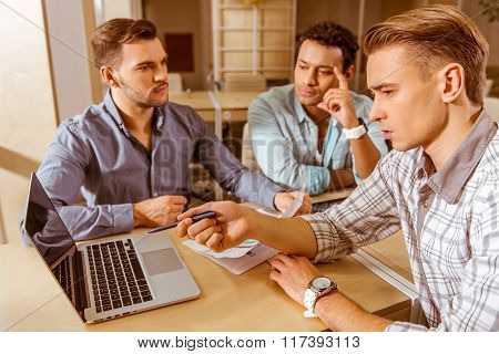Young Handsome Businessmen Coworking