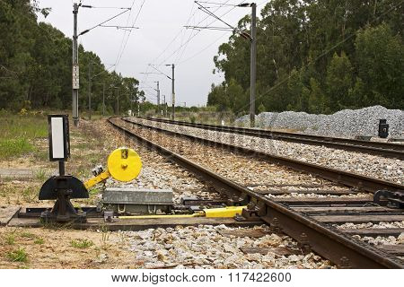 Needle chagging of train line in a rural environment
