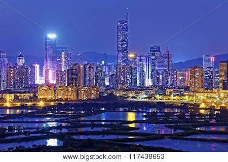 Shenzhen citscape at night , view from hiong kong countryside