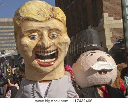 hillary and the monopoly man do mardi gras