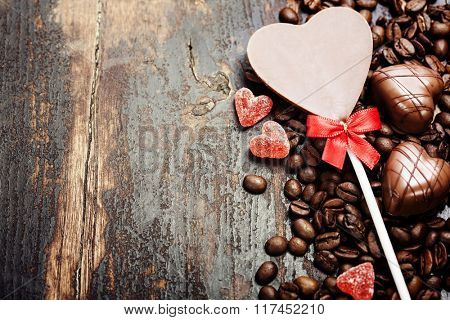 Coffee and chocolate  on grunge wooden background - Valentine's day and love concept