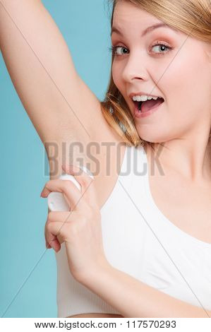 Girl Applying Stick Deodorant In Armpit.