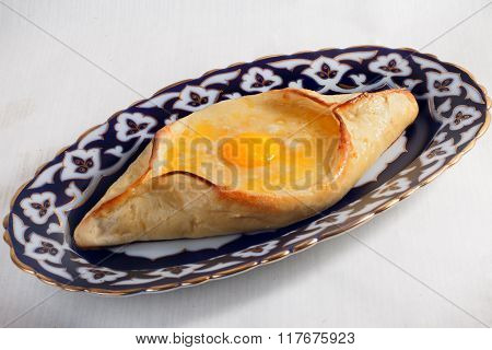 khachapuri meal oriental plate with egg isolated Uzbek dishes