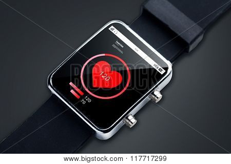 modern technology, object, healthcare and media concept - close up of black smart watch with pulsometer and heart-rate icon on screen