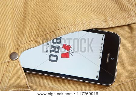 Iphone 5S With Mobile Application For Bro On The Screen In Orange Jeans Pocket