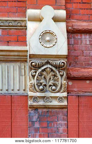 Beautiful capstone graces a downtown building in Houghton Michigan. Brick is red sandstone.