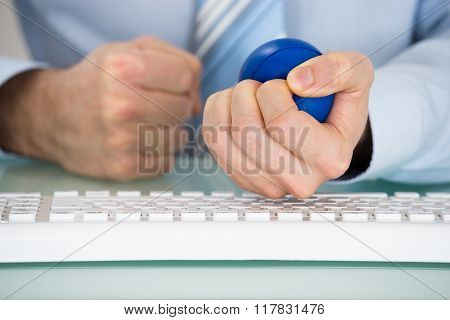 Businessman Pressing Stressball