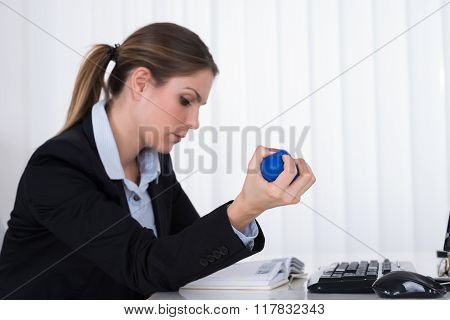 Businesswoman Pressing Stressball