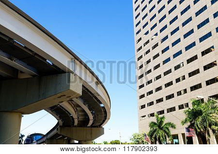 elevated commuter near modern skyscraper building in Miami