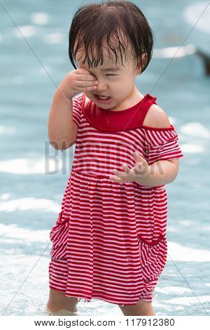 Chinese Little Girl Playing In Water