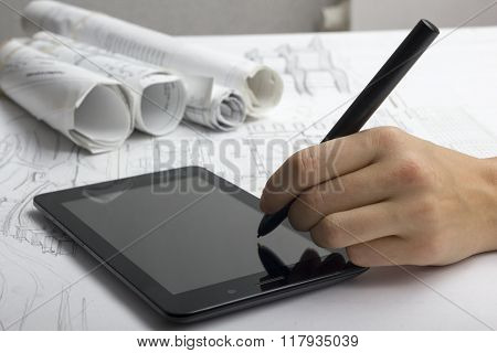 Architect working on blueprint. Architects workplace - architectural project, blueprints, ruler, cal