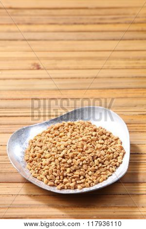 fenugreek on the bamboo background