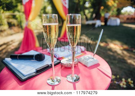 Wedding glasses filled with champagne at the banquet