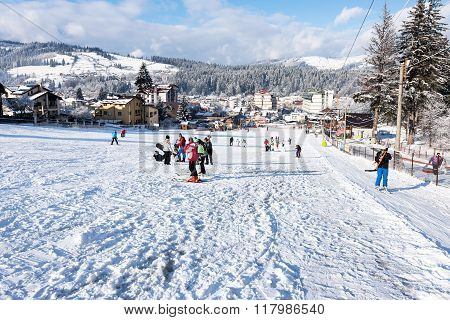 VATRA DORNEI, ROMANIA - FEBRUARY 2016: Ski slope with happy people at mountains with blue sky on 04t