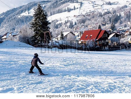 VATRA DORNEI, ROMANIA - FEBRUARY 2016: A kid skiing at a ski slope on 04th of February in Vatra Dorn