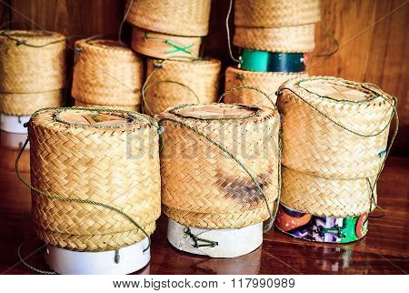 Sticky rice wicker (Kratip rice) on wooden table