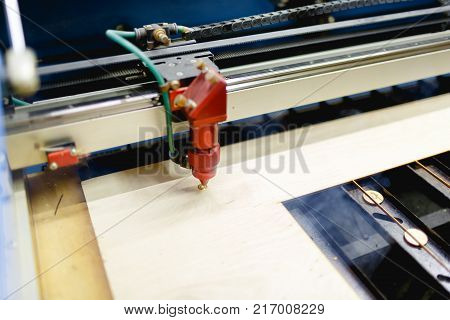 Automatic machine burns the laser wheel on the workpiece. There is smoke from work