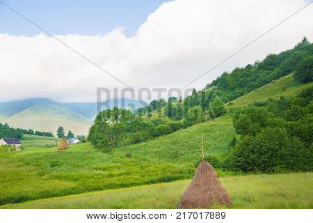 Haystack summer in the beautiful village Ukrainian Carpathians