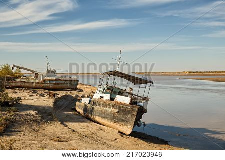 Old rusty ships on the banks of the Amudarya River